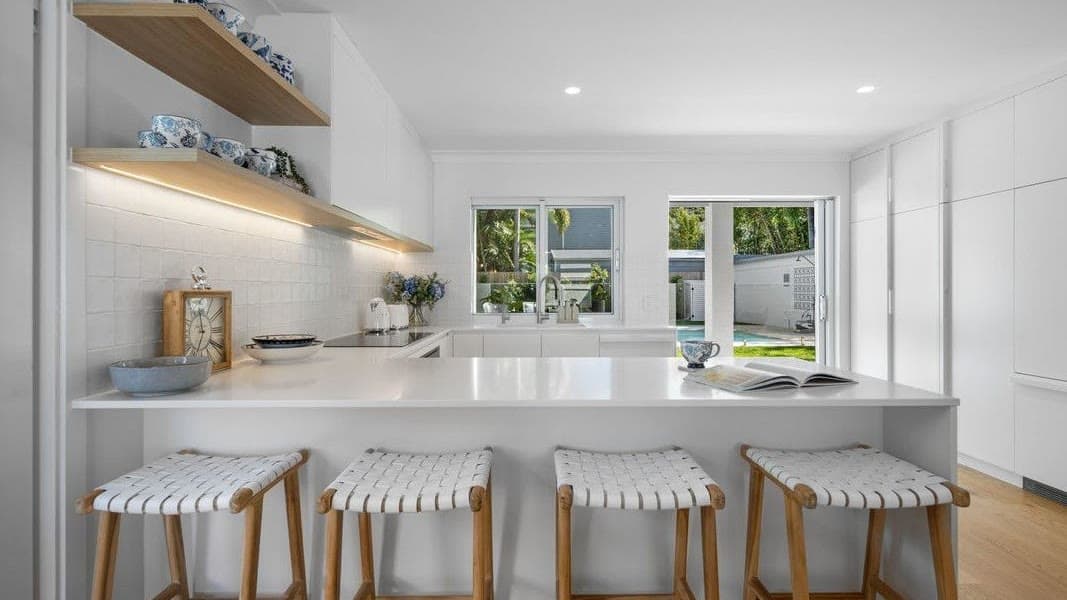 A kitchen as it was taken on a phone, and the same photo enhanced